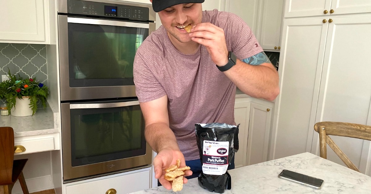 man eating microwaveable pork rinds 