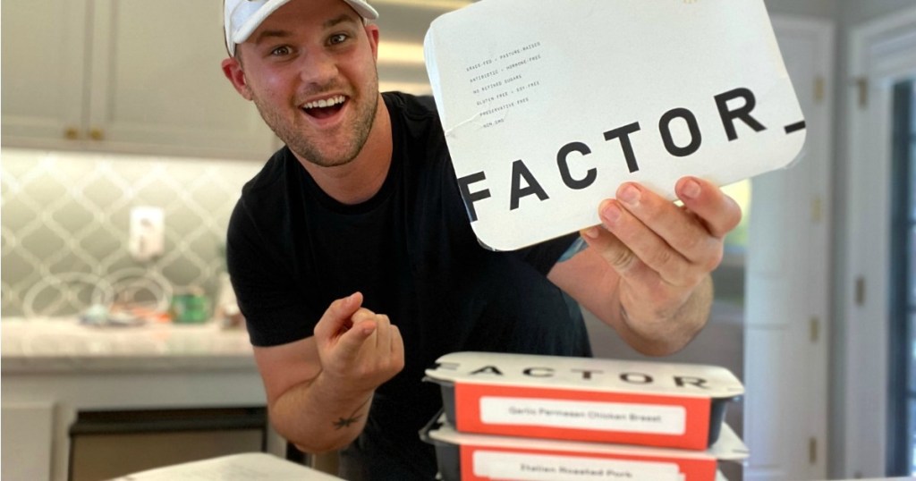 man holding Factor meals 