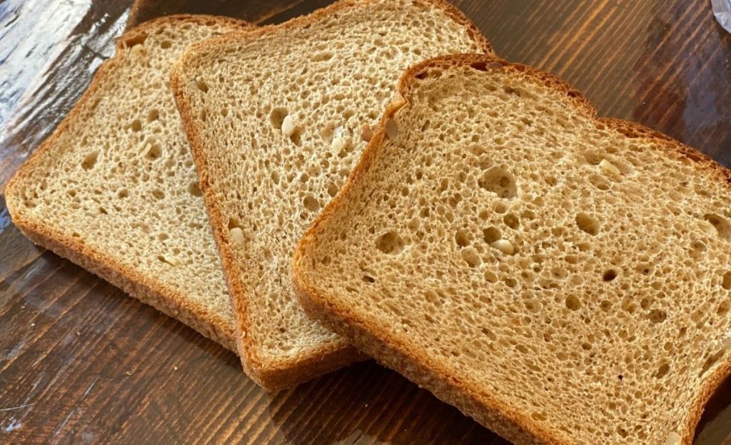 Three slices of bread on a table