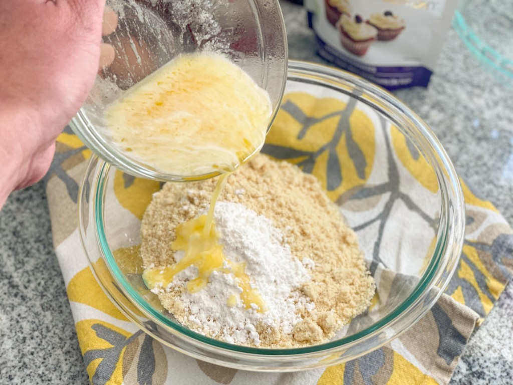 adding melted butter to mixing bowl