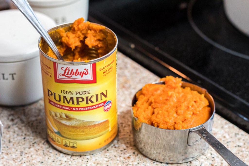 pumpkin puree in a measuring cup