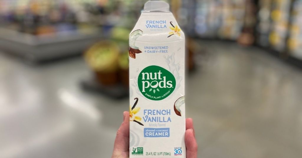 hand holding a Nutpods coffee creamer