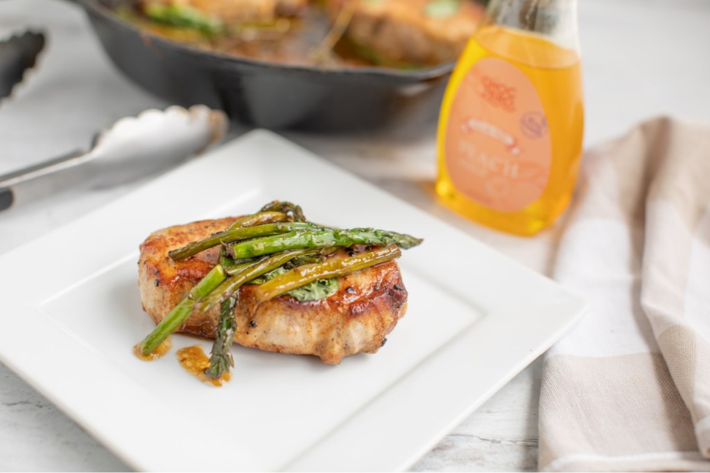 Peach glazed pork chops on a plate