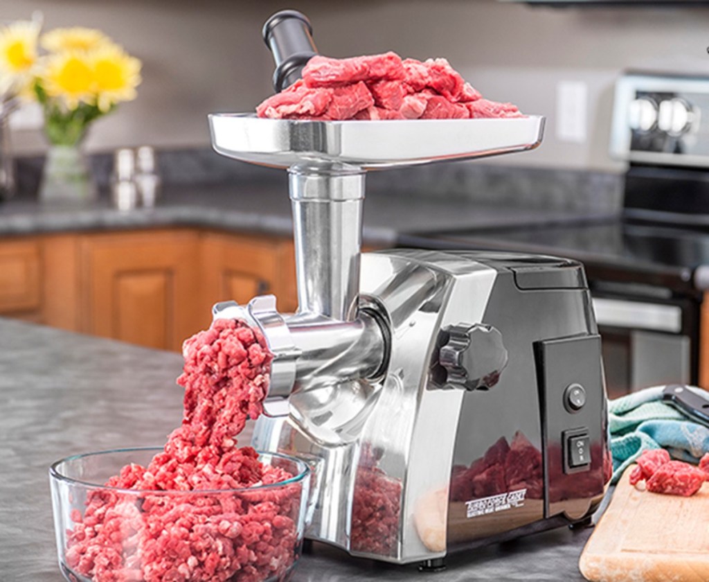 stainless steel meat grinder on countertop