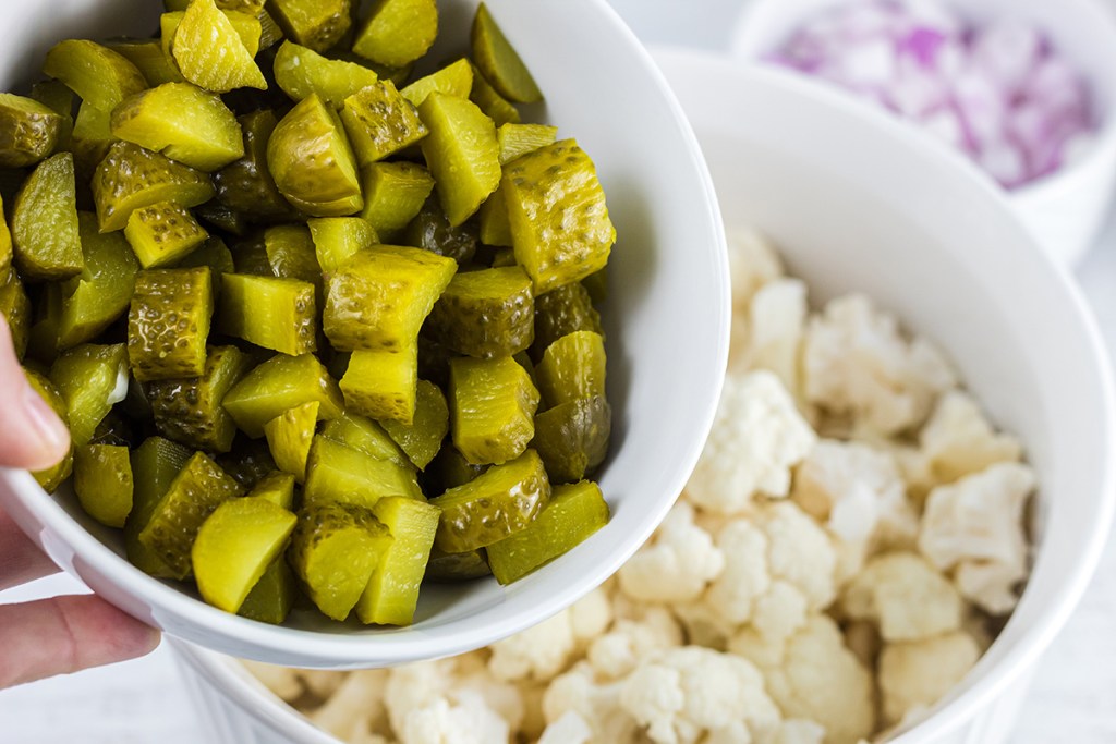 bowl of chopped pickles for keto dill pickle cauliflower salad