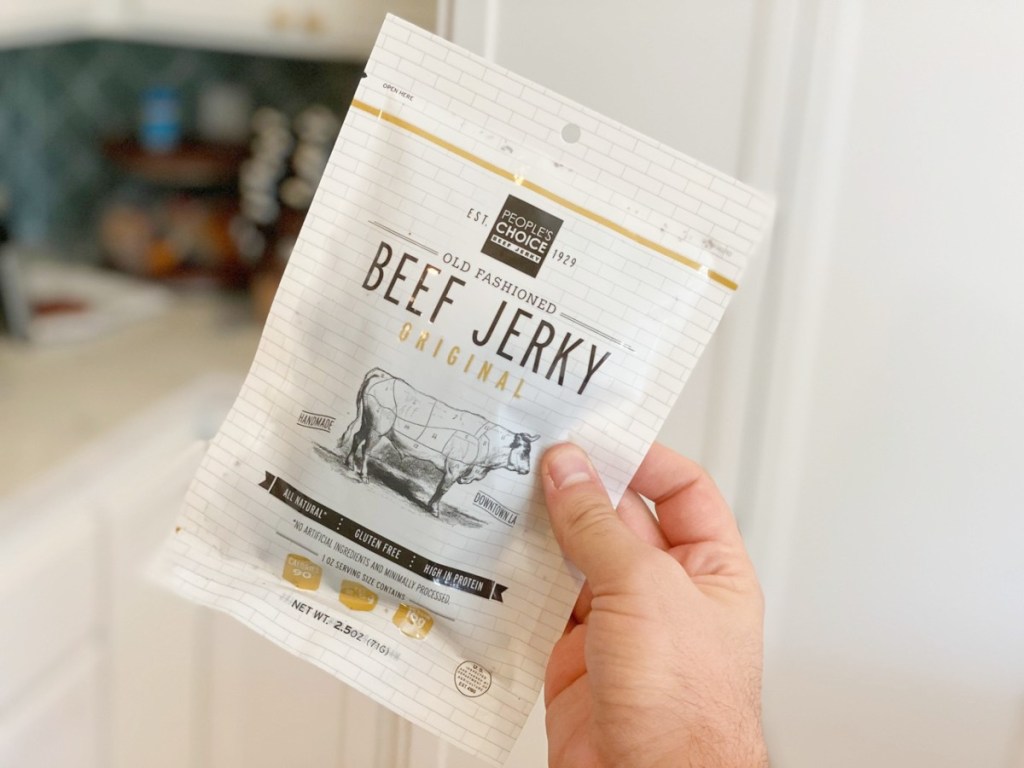 holding a package of People's Choice beef jerky