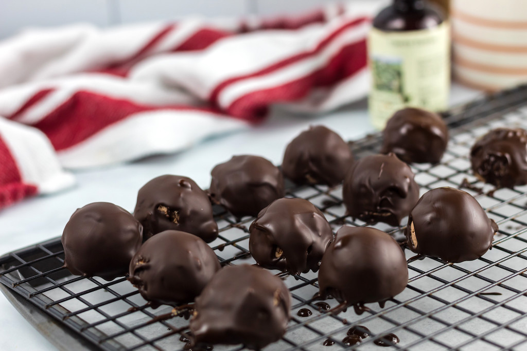 keto chocolate covered cherry fat bombs on cooling rack