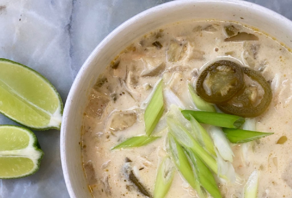 keto green enchilada soup with sliced green onion