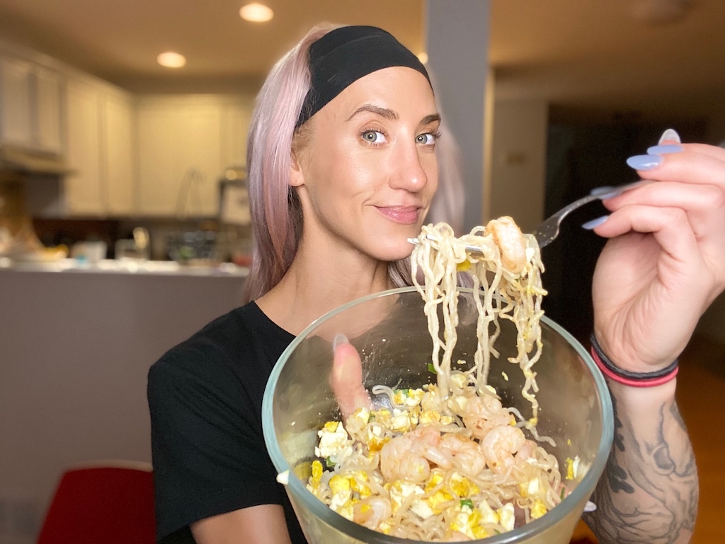 woman with keto noodles on fork 