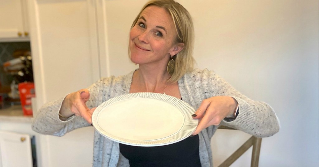 woman holding empty plate