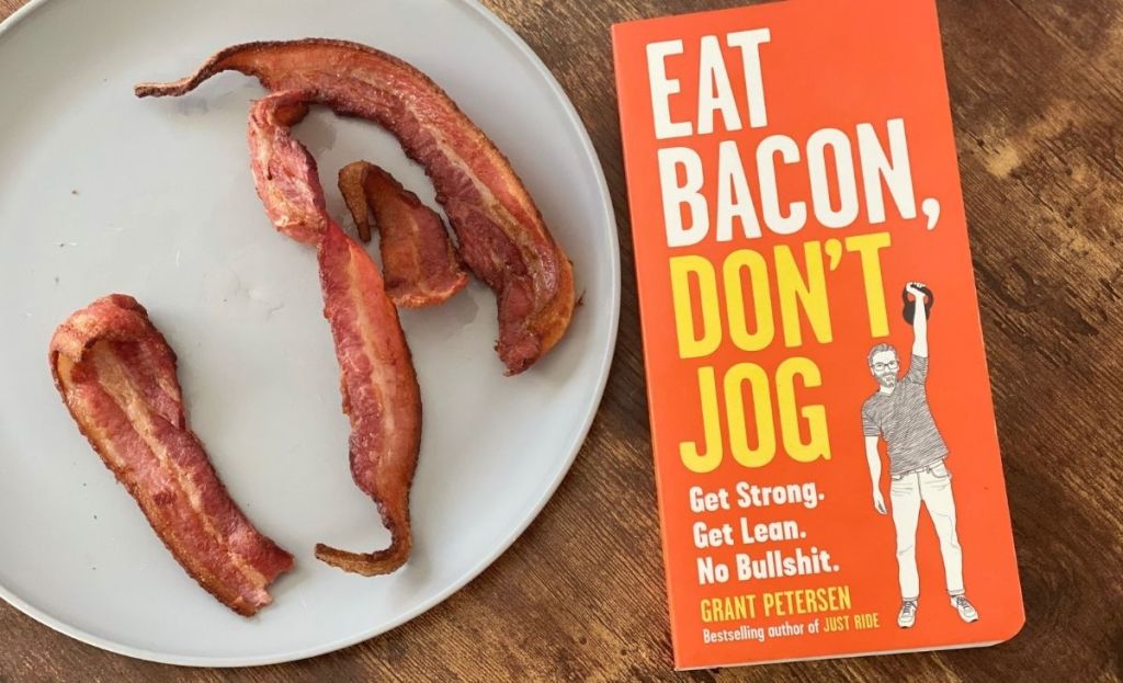 A book next to a plate of bacon