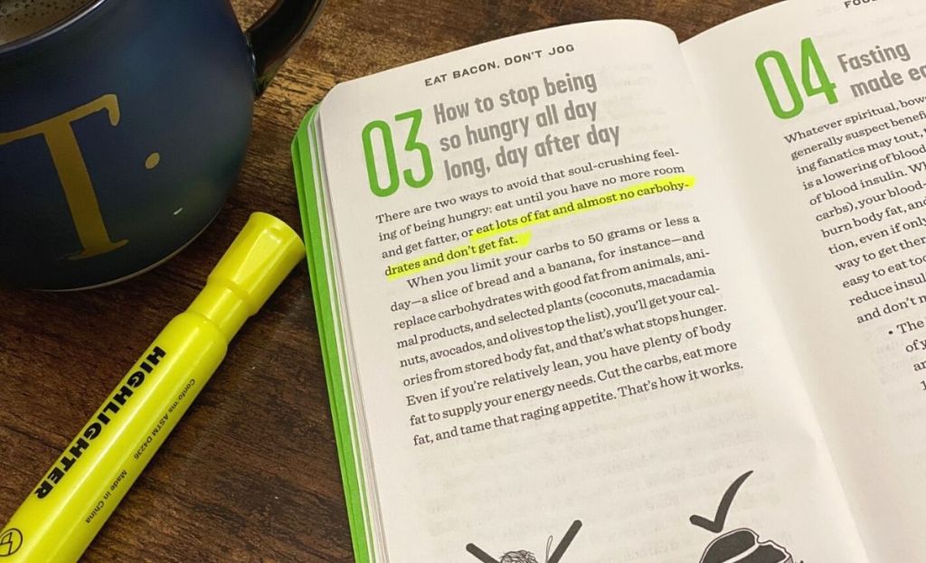 A highlighter and a book on a desk