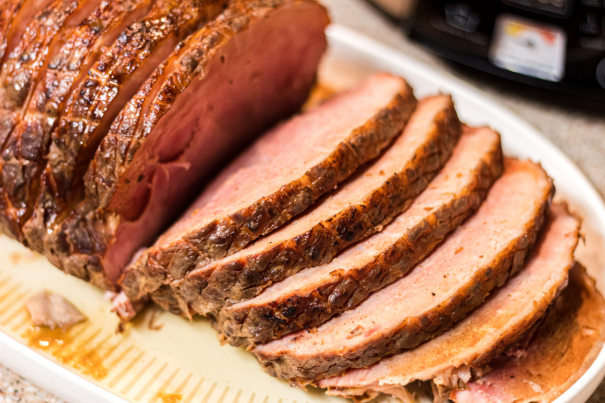 slices of crockpot keto ham on serving platter