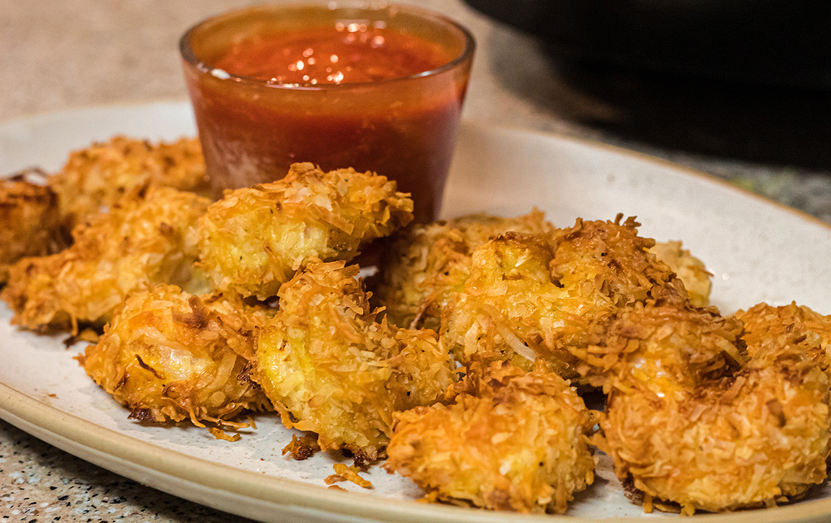 Keto Coconut Shrimp on a plate, one of our favorite game day snacks and finger foods