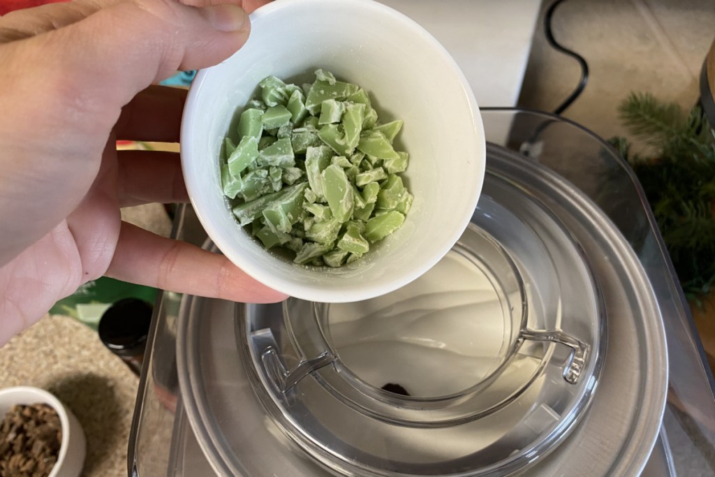 peppermint candy being poured into ice cream maker