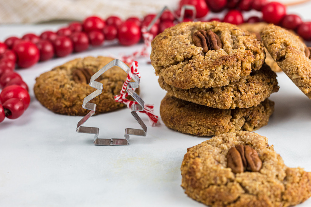 keto maple pecan cookies sitting on festive Christmas table 