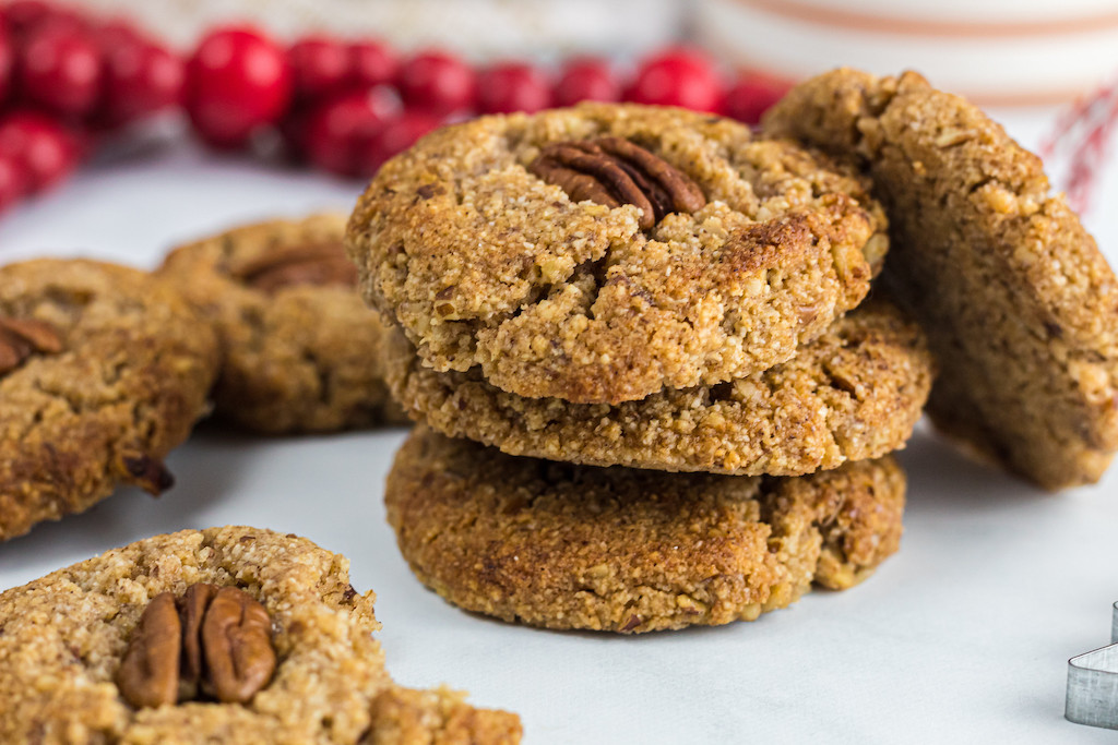 keto maple pecan cookies stacked up 