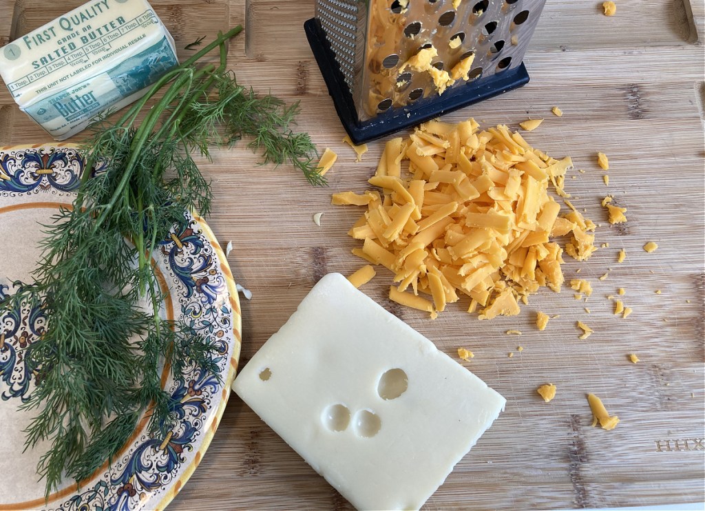 grating swiss and cheddar