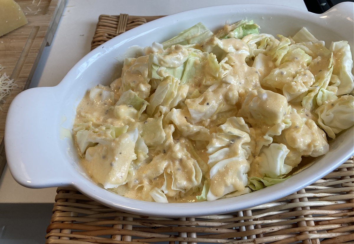 scalloped cabbage in a baking dish before baking