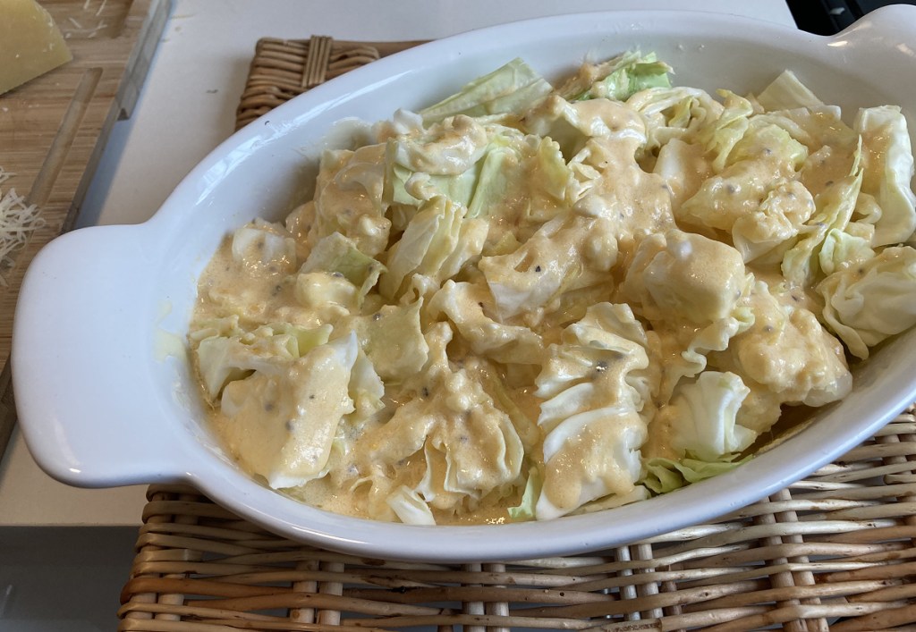 cabbage covered in cheese sauce