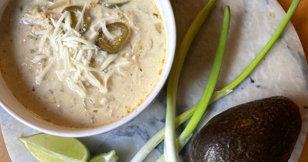 keto crockpot chicken enchilada soup in bowl with jalapeños and cheese