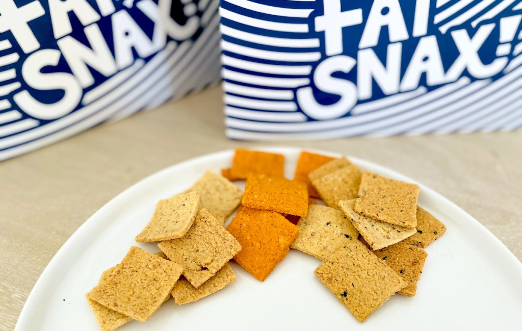 three types of crackers on white plate