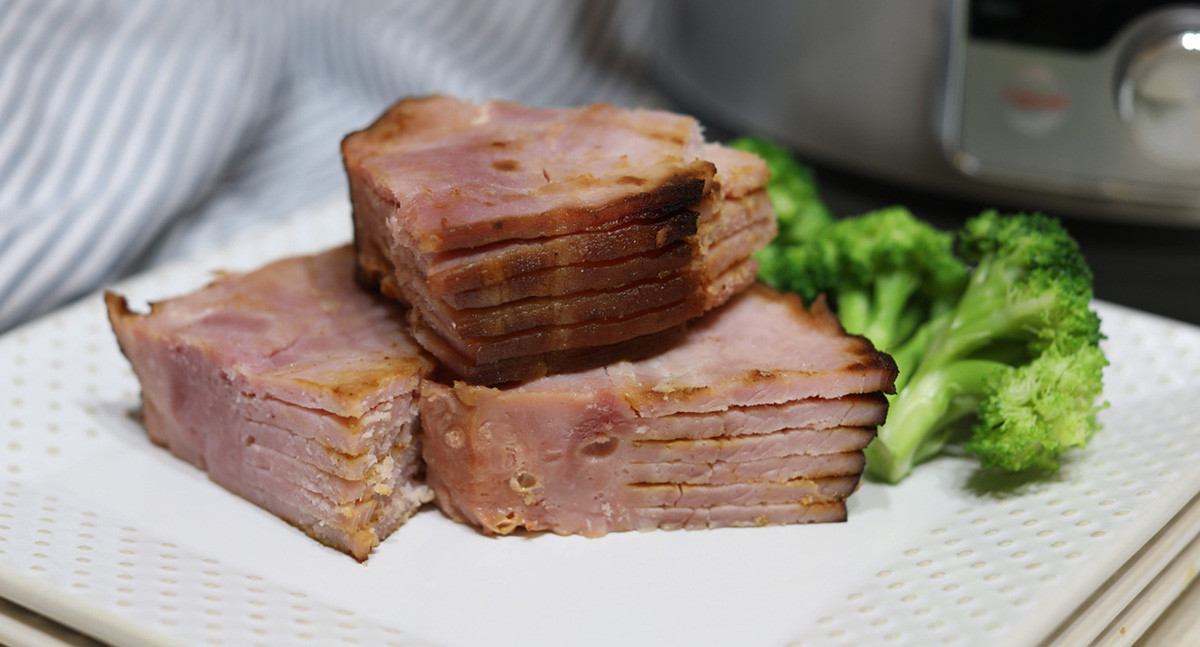 keto sliced ham on plate with broccoli