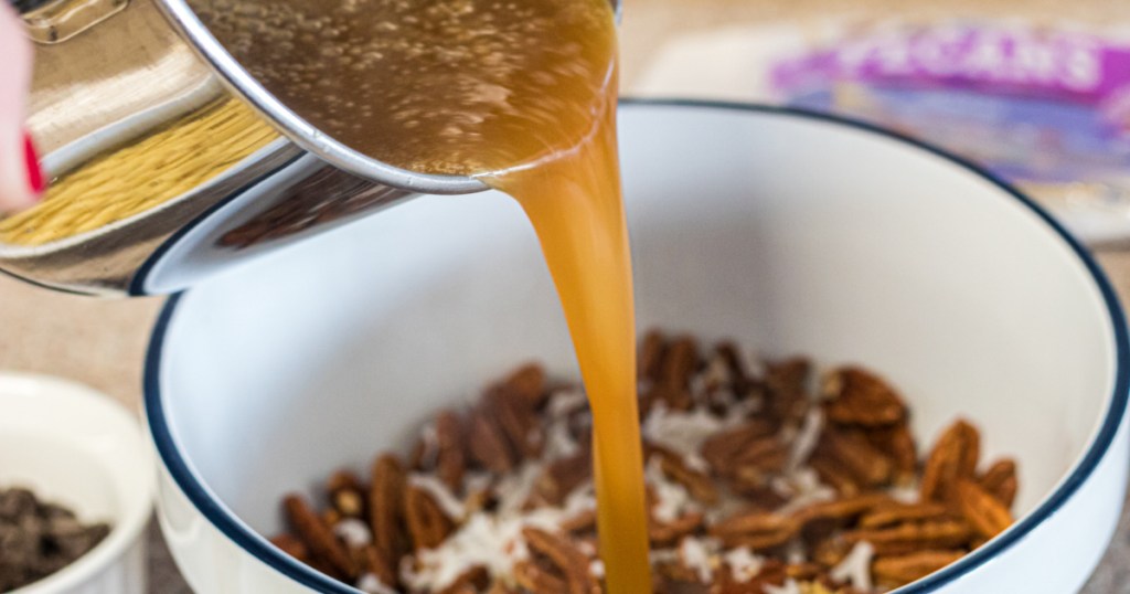 pouring buttered sugar into pecans