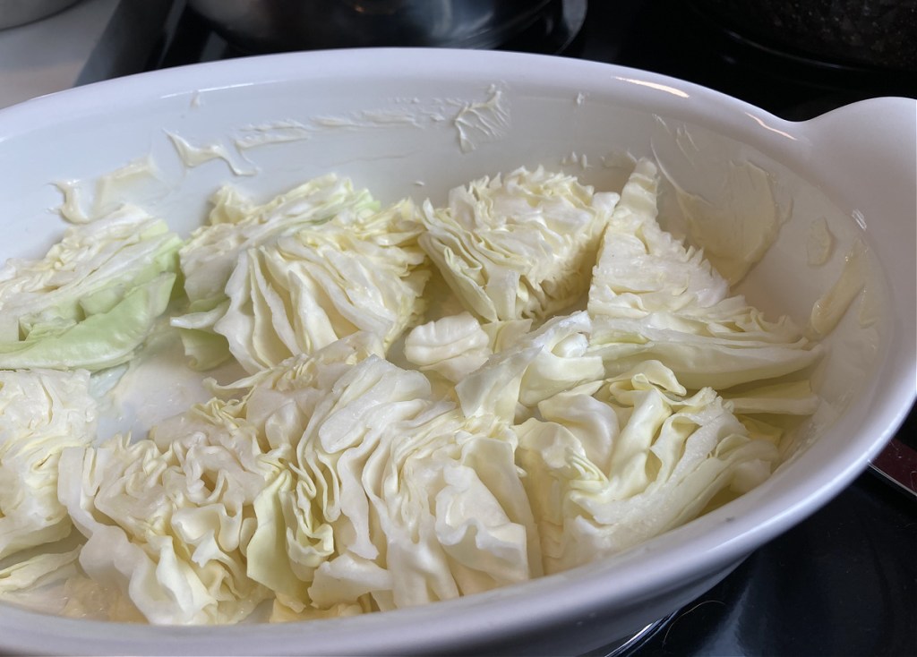 layering cabbage slices into dish