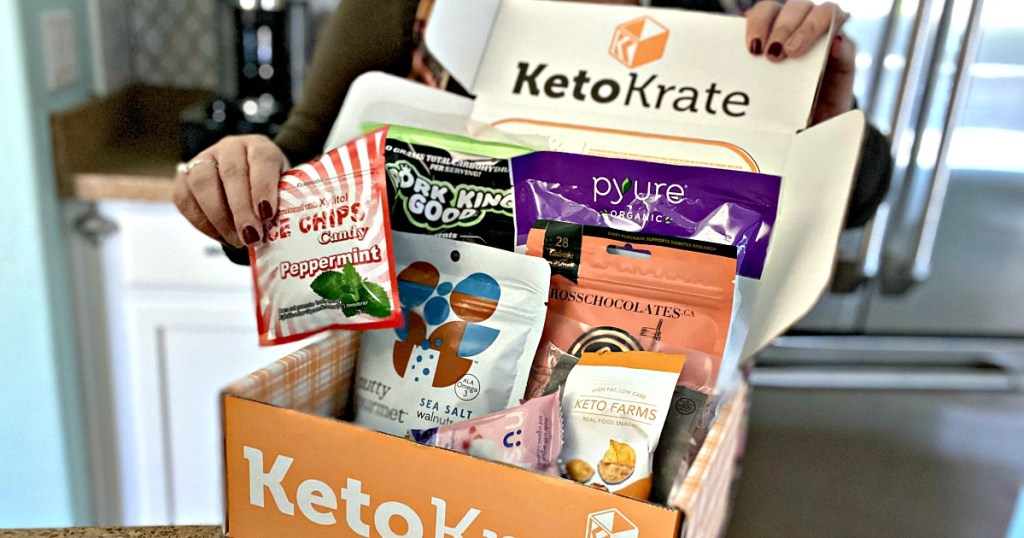 hands opening orange keto krate box