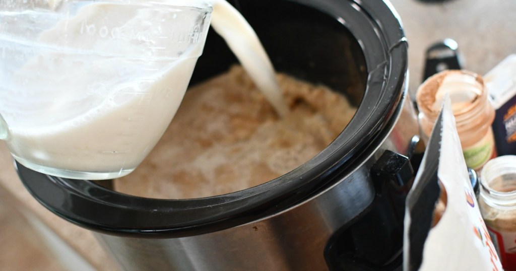pouring almond milk into keto slow cooker lattes