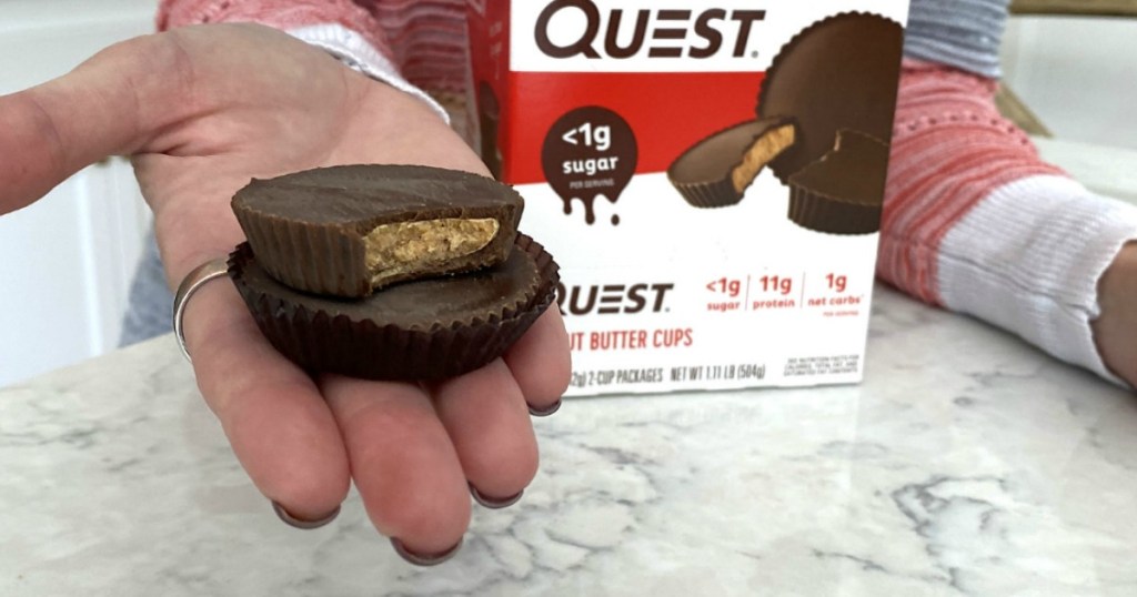 holding Quest peanut butter cups 