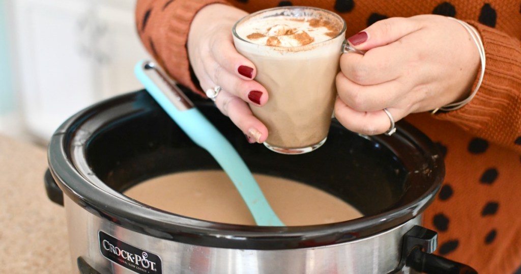 woman holding a crockpot keto gingerbread latte