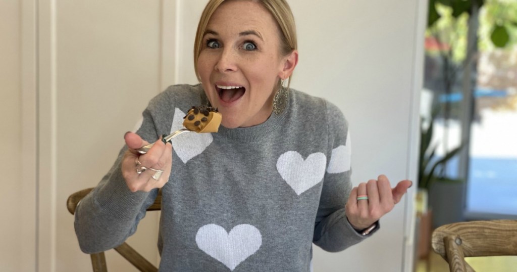 woman with large spoon of peanut butter and Lily's baking chips