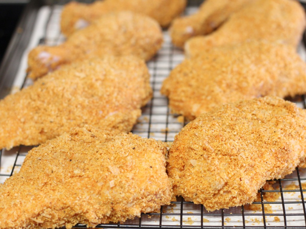 breaded chicken on drying rack