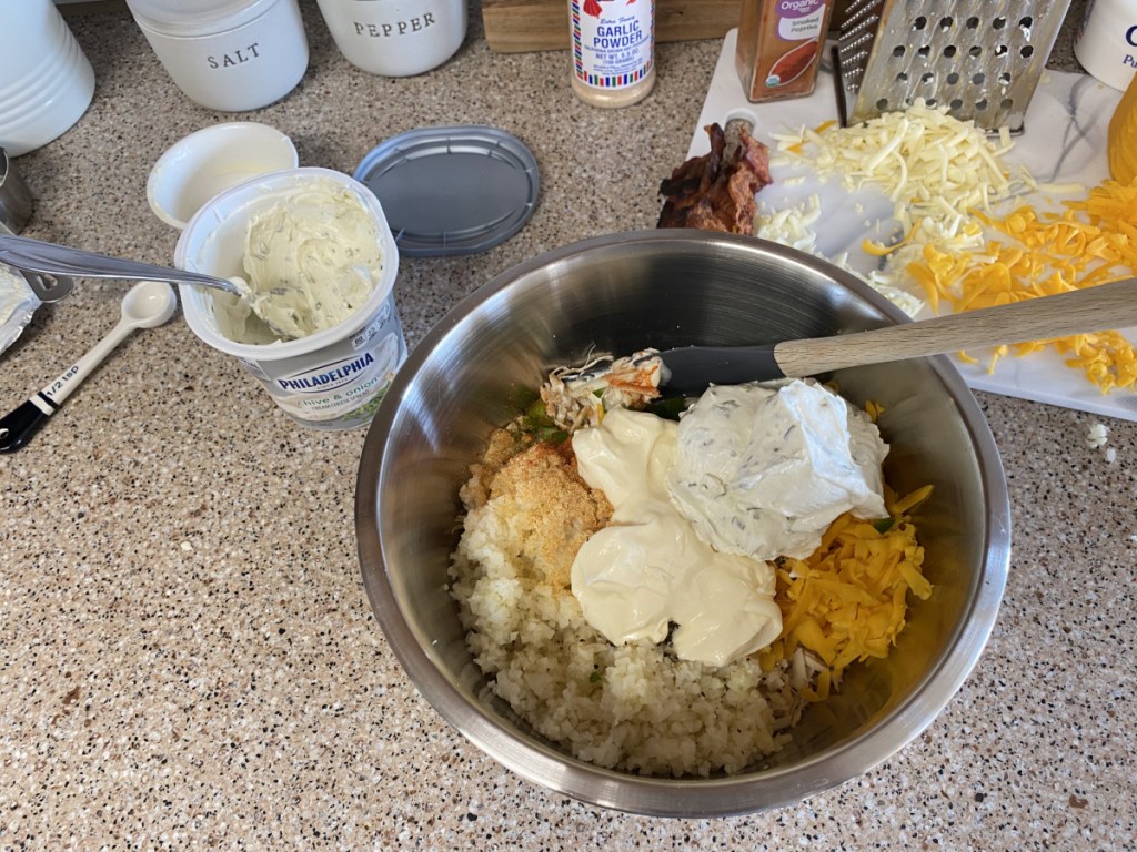 mixing chicken and cream cheese together