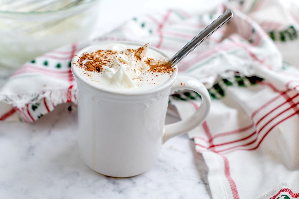 keto gingerbread latte in white coffee mug with whipped cream and cinnamon 