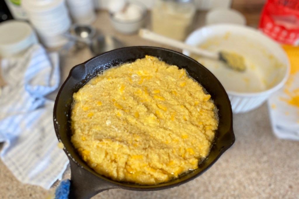 keto cornbread batter in a cast iron skillet