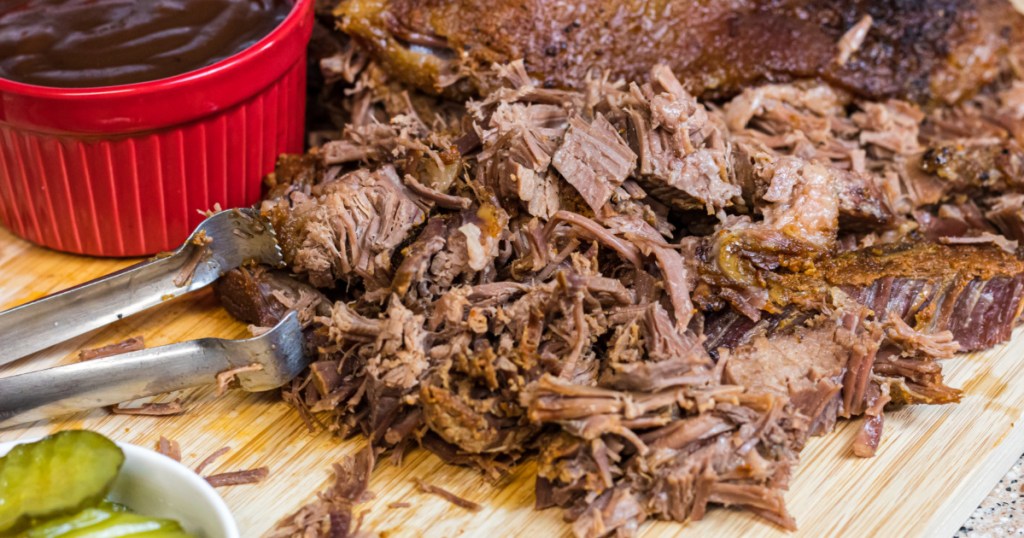 shredded brisket on a cutting board