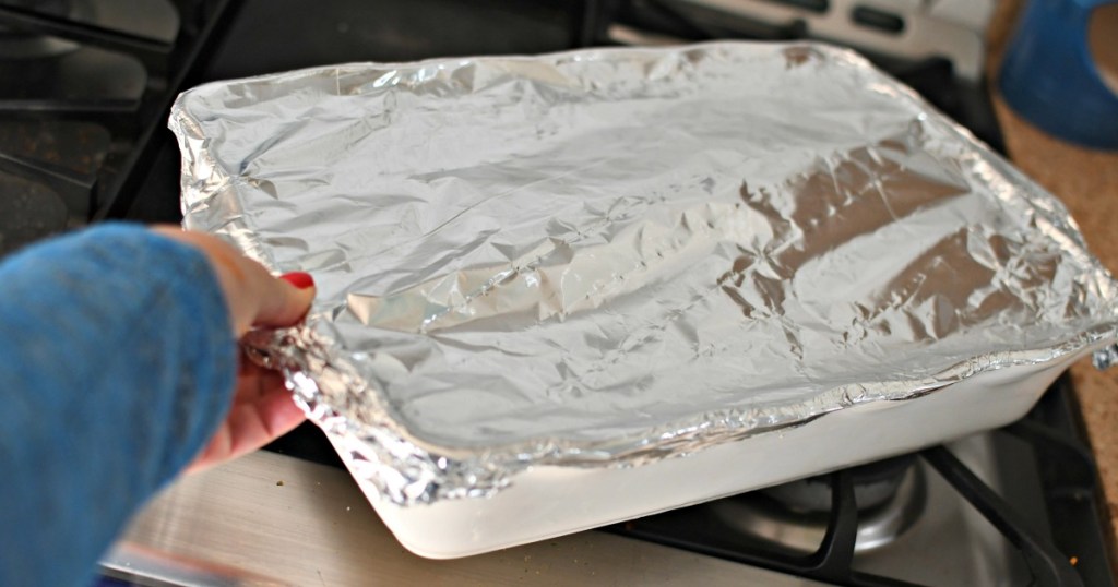 adding foil to cook stuffed peppers