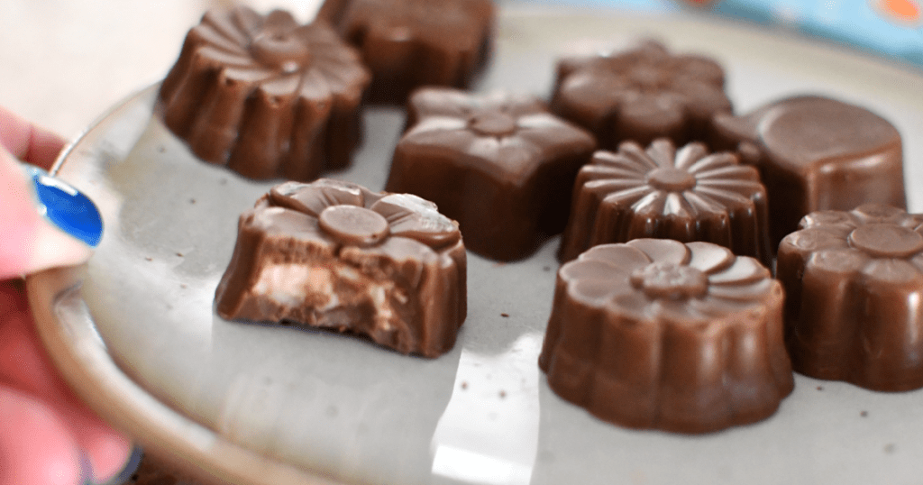 holding plate of choczero coconut keto truffles 