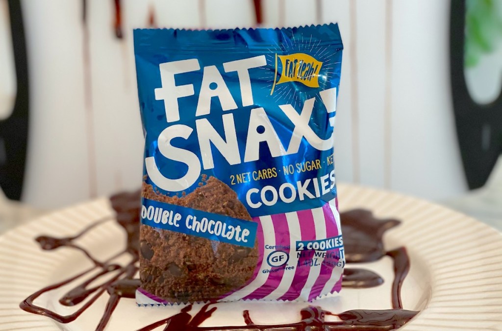 fat snax chocolate cookie on plate with chocolate sauce