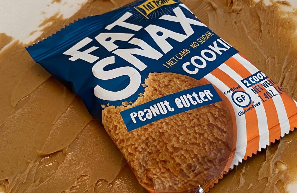 fat snax peanut butter cookie on counter laying on smeared peanut butter