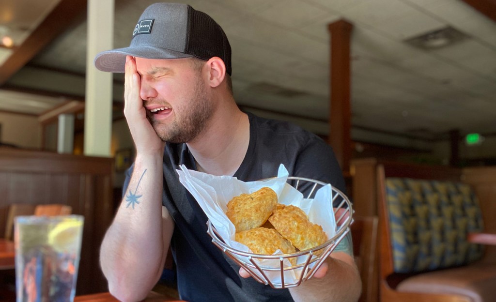 man with cheddar bay biscuits