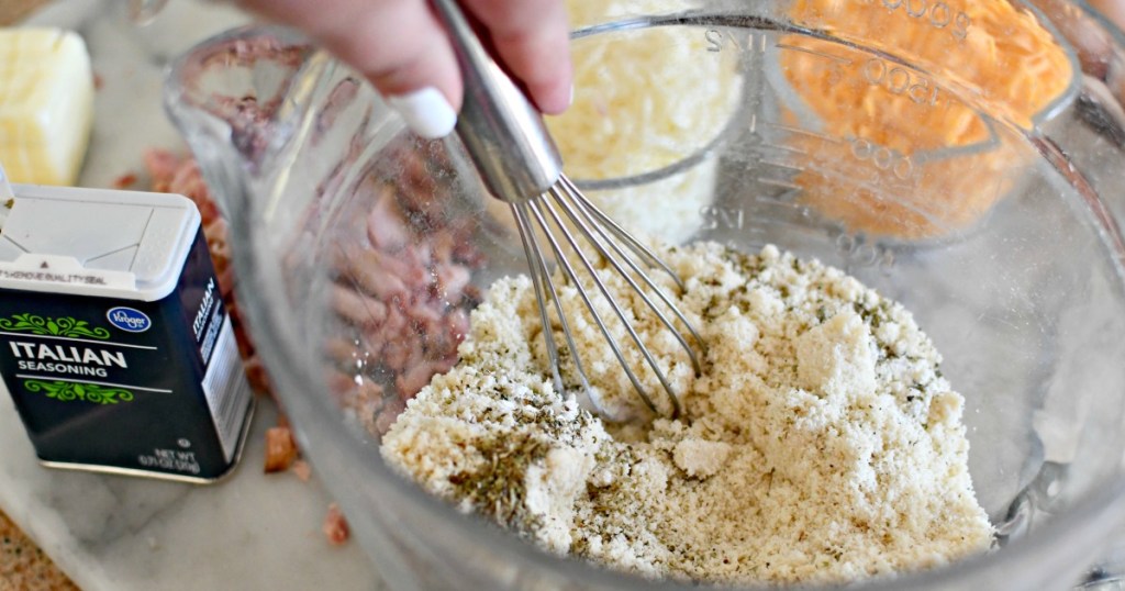 mixing almond flour and italian seasoning