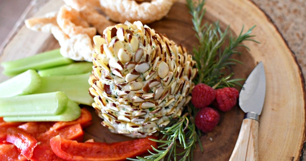 pine cone cheese ball on a wood platter