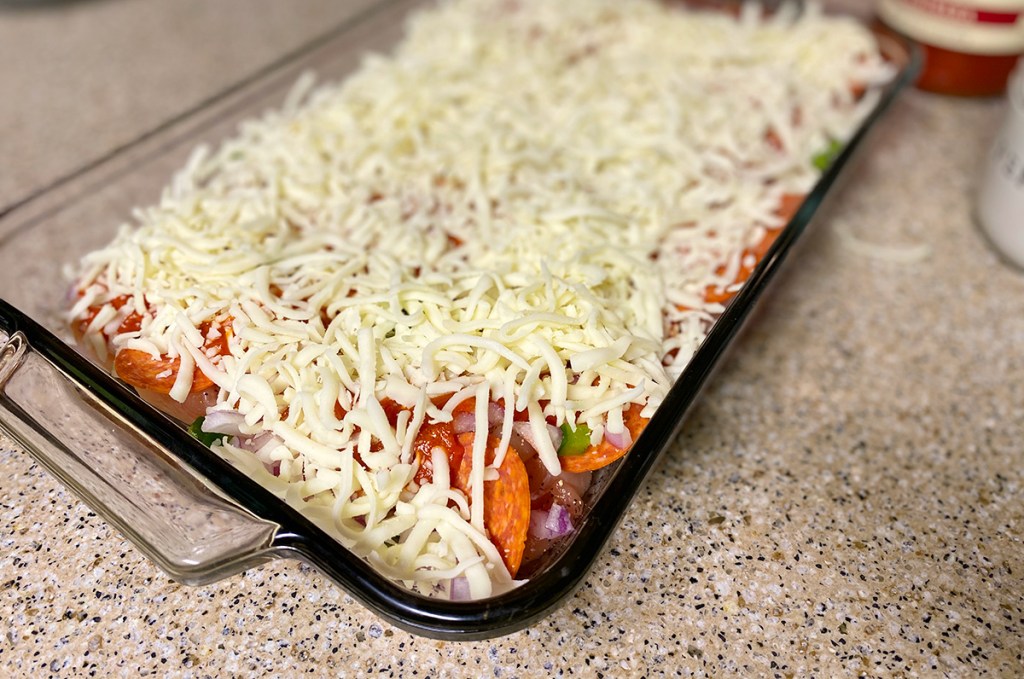 keto pizzas casserole in dish before going into the oven
