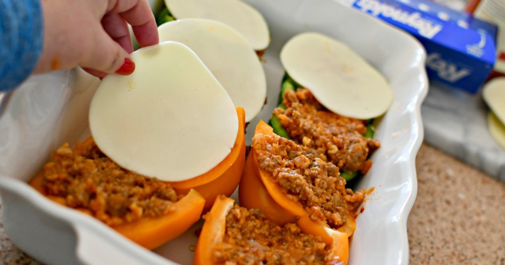 putting cheese on top of keto stuffed peppers