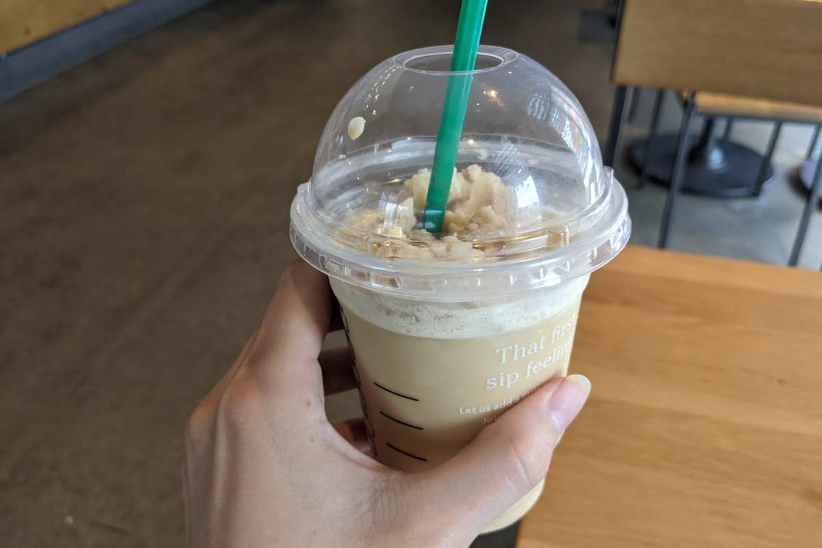 hand around keto Frappuccino on counter