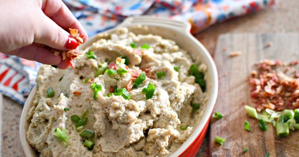 topping slow cooker cauliflower with bacon and onion